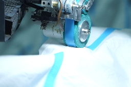 Attaching Tapes on Coveralls